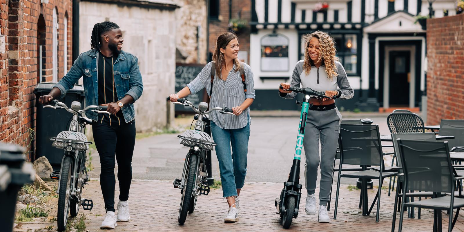 Beryl bikes and scooter in sunny street 