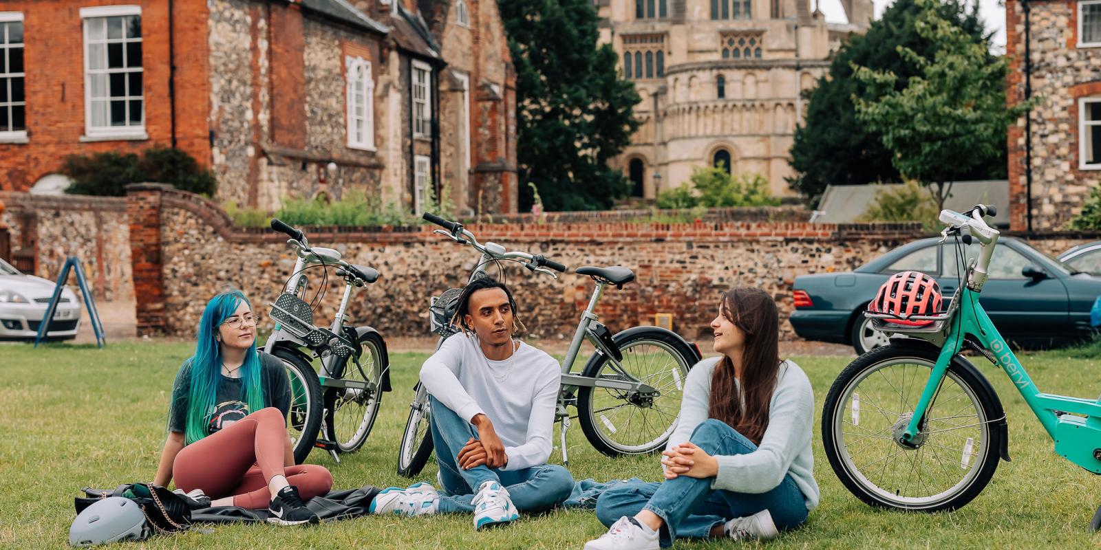 Beryl riders and bikes in front of Norwich Cathedral