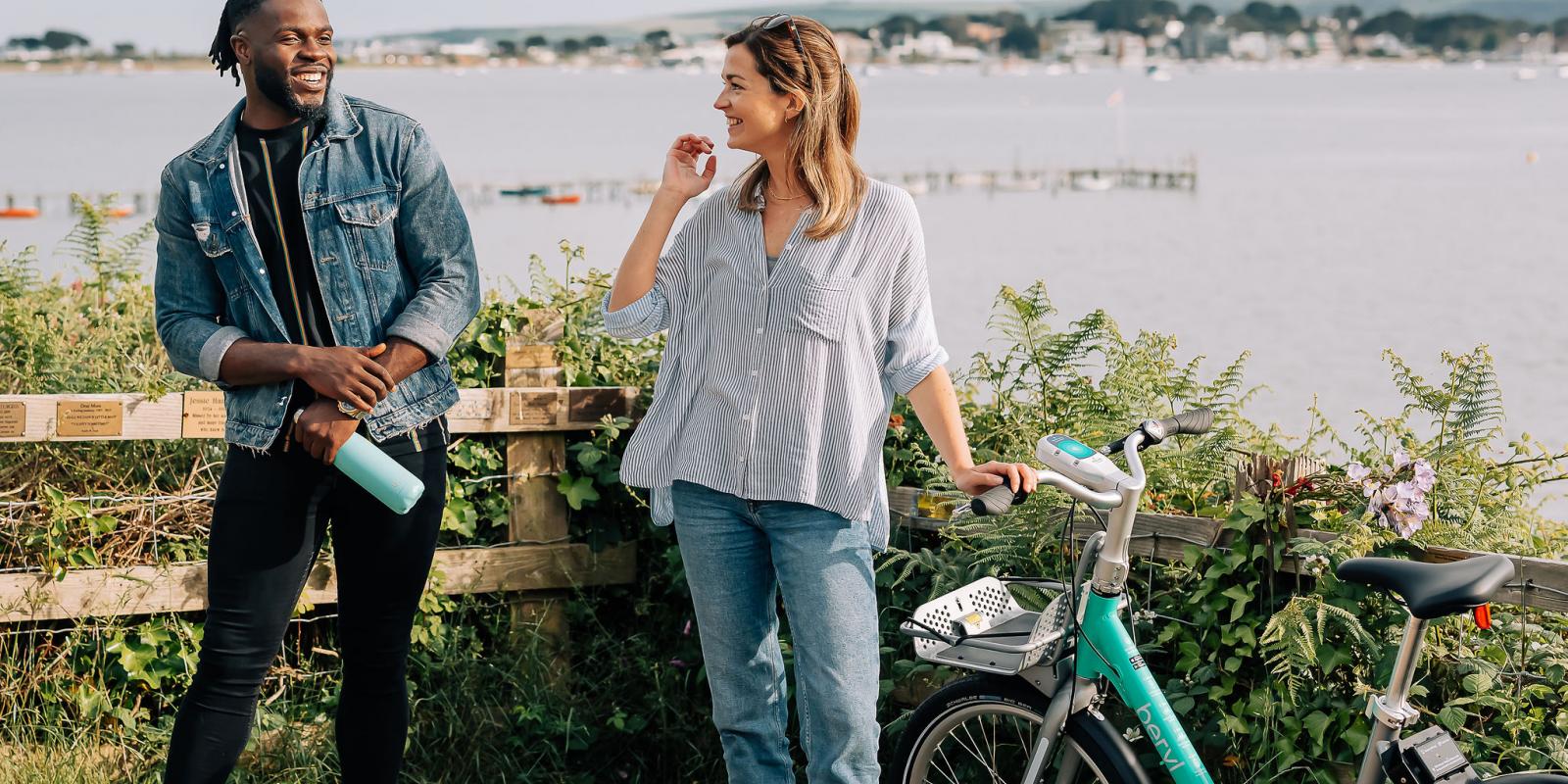 man and woman with Beryl bike in Bournemouth