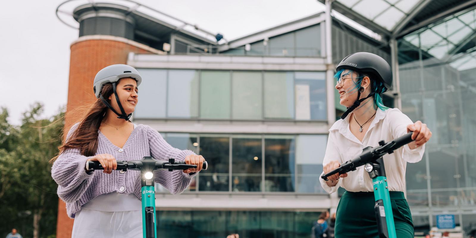 women riding Beryl e-scooters in Norwich