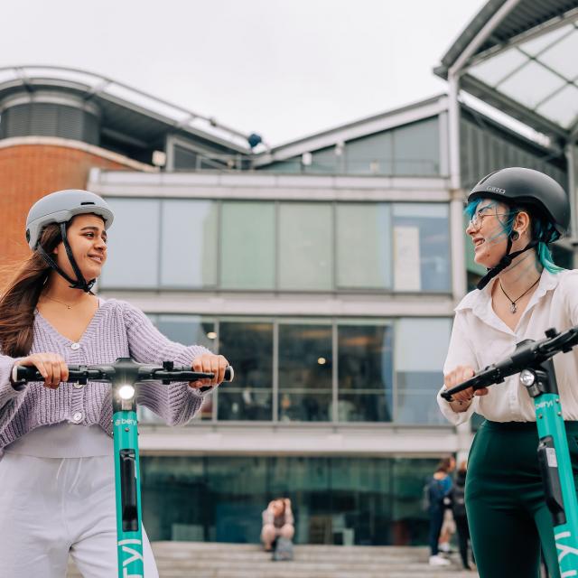 women riding Beryl e-scooters in Norwich