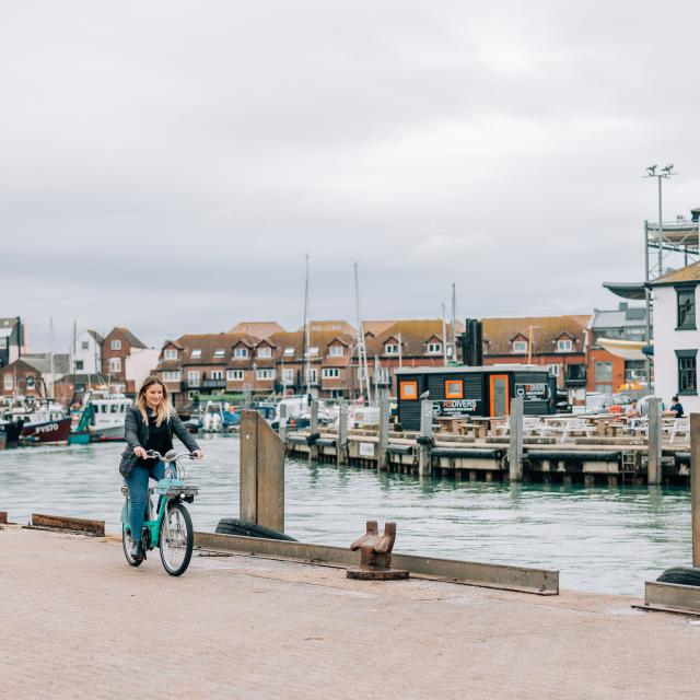 woman riding Beryl bike in Portsmouth