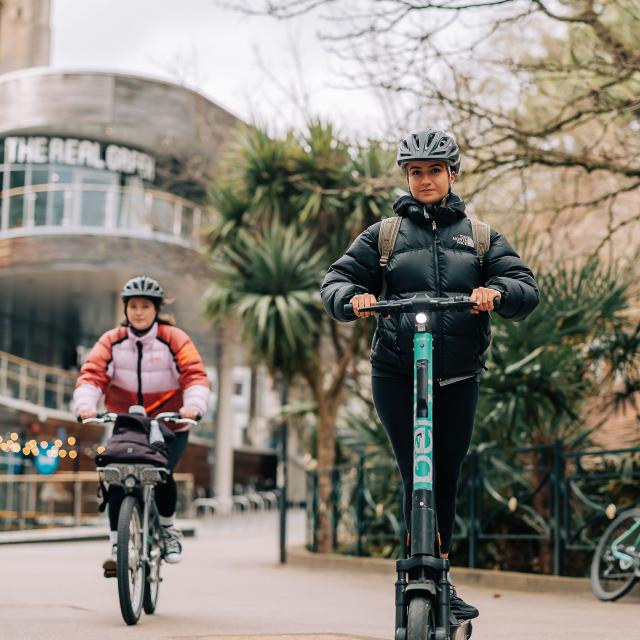 woman riding Beryl scooter