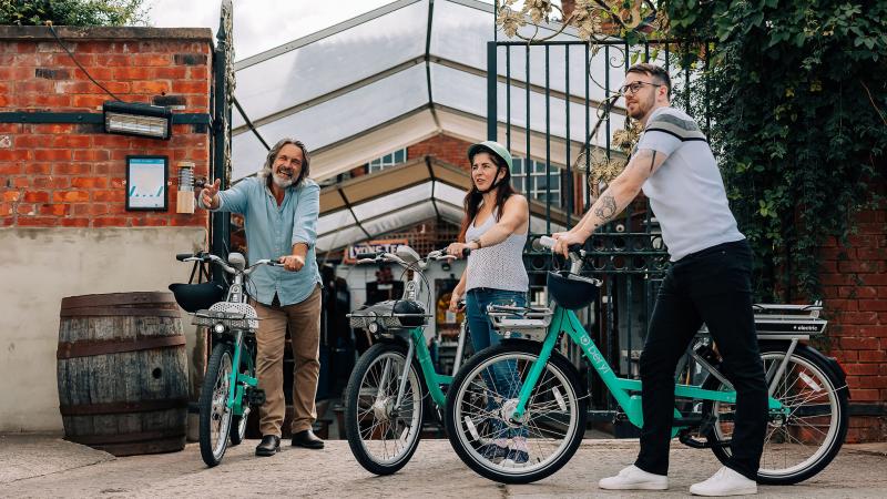 Three people with Beryl bikes