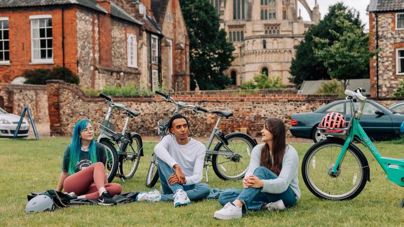 Beryl riders and bikes in front of Norwich Cathedral