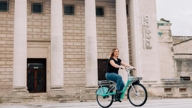 Woman riding Beryl bike in Southampton