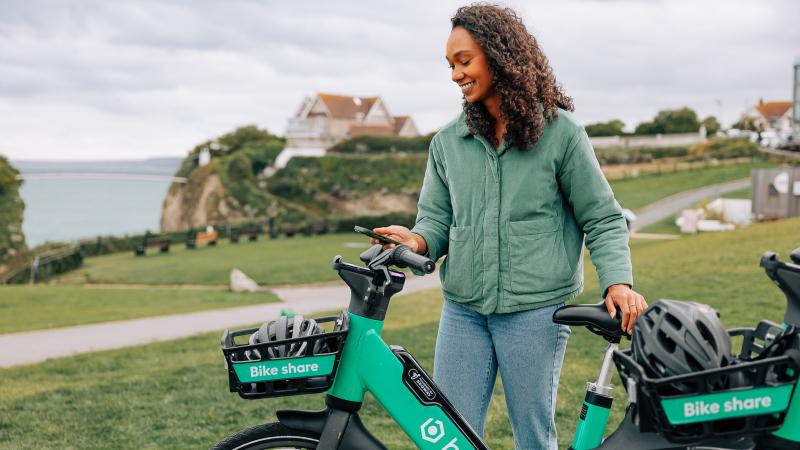 Woman with Beryl bike in Cornwall